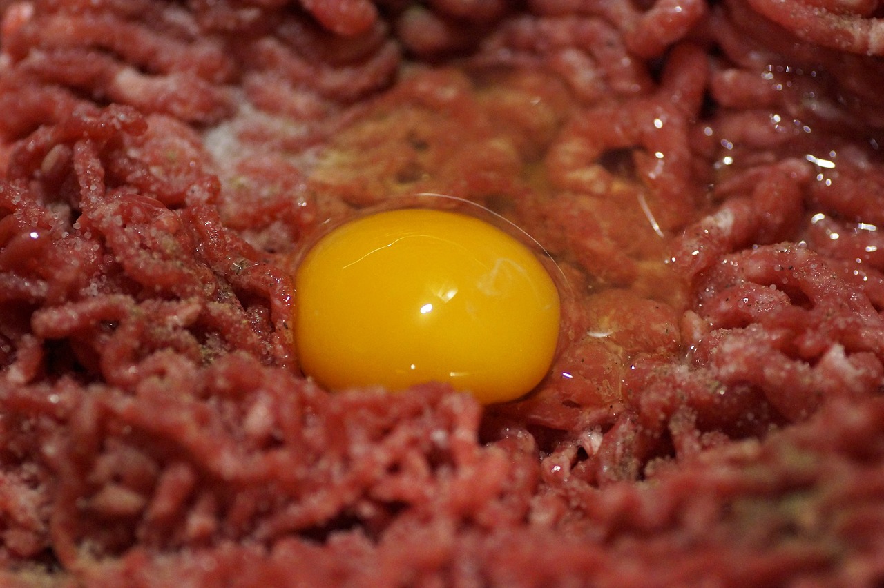 Cracked Raw Egg Over Dog Food